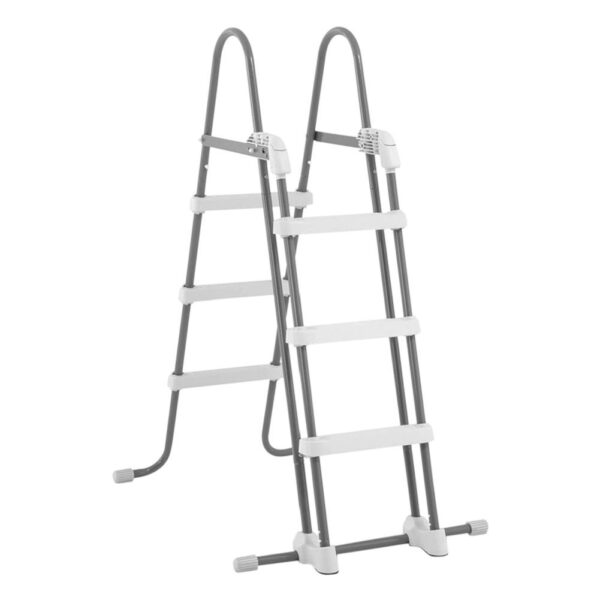 “Rectangular above‑ground Intex Prism Frame Pool (13.1 ft × 6.5 ft × 39 in) with grey sidewalls, white powder‑coated steel frame, and blue patterned interior, shown assembled on grass and accompanied by its A‑type filter pump cartridge, vertical ladder, and filter pump unit.”