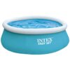 Small above-ground Intex pool set up and filled, designed for easy summer use and family fun.