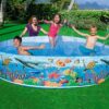 Intex 58472 children’s pool with colorful beach-themed duck cartoon design, filled with water, and featuring a non-inflatable, rigid sidewall.