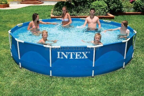 Intex 28210 round metal frame swimming pool set up on a grassy lawn, being filled with water.